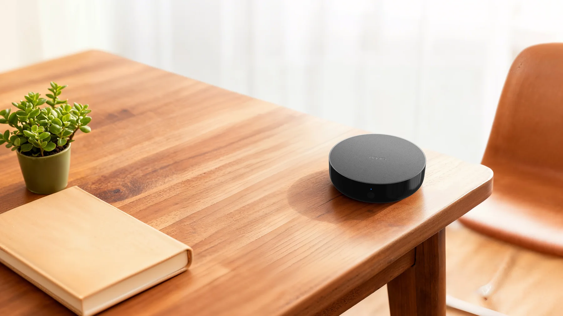 Aqara Hub M200 on a table in a bright living space