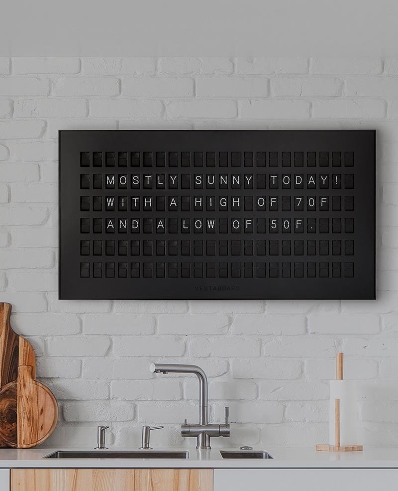 Vestaboard displaying an inspiring message in a living room