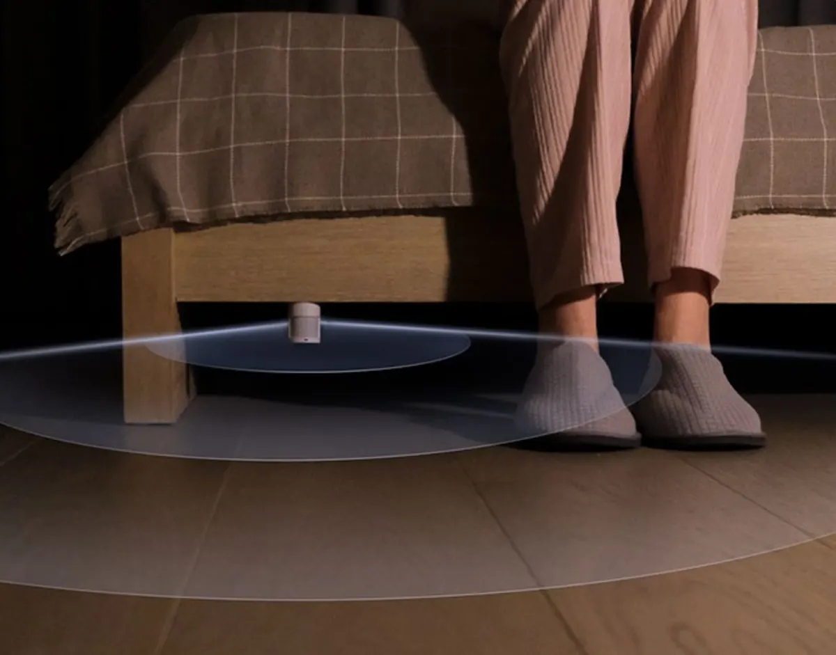 Aqara Motion and Light Sensor P2 under a bed, sensing feet on the floor at night