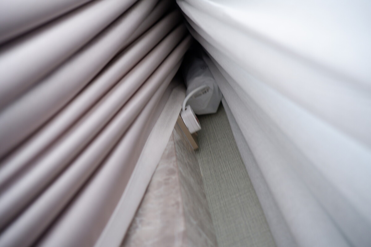 Aqara curtain motor installed behind day and night curtain fabric