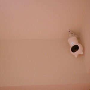 Aqara security camera installed near the ceiling of a home