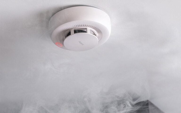 Smoke detector sounding in a smoky kitchen