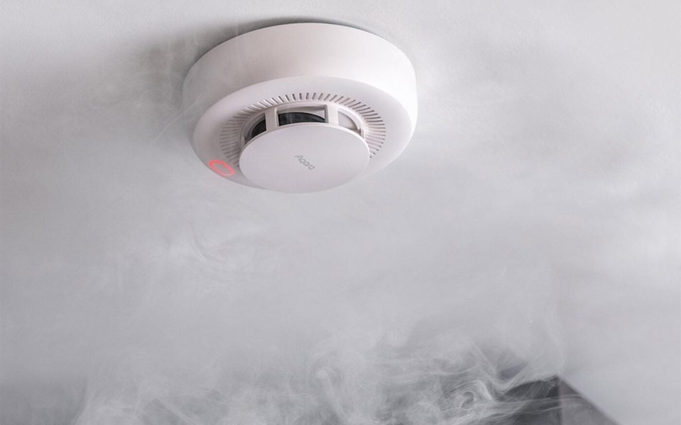 Smoke detector sounding in a smoky kitchen