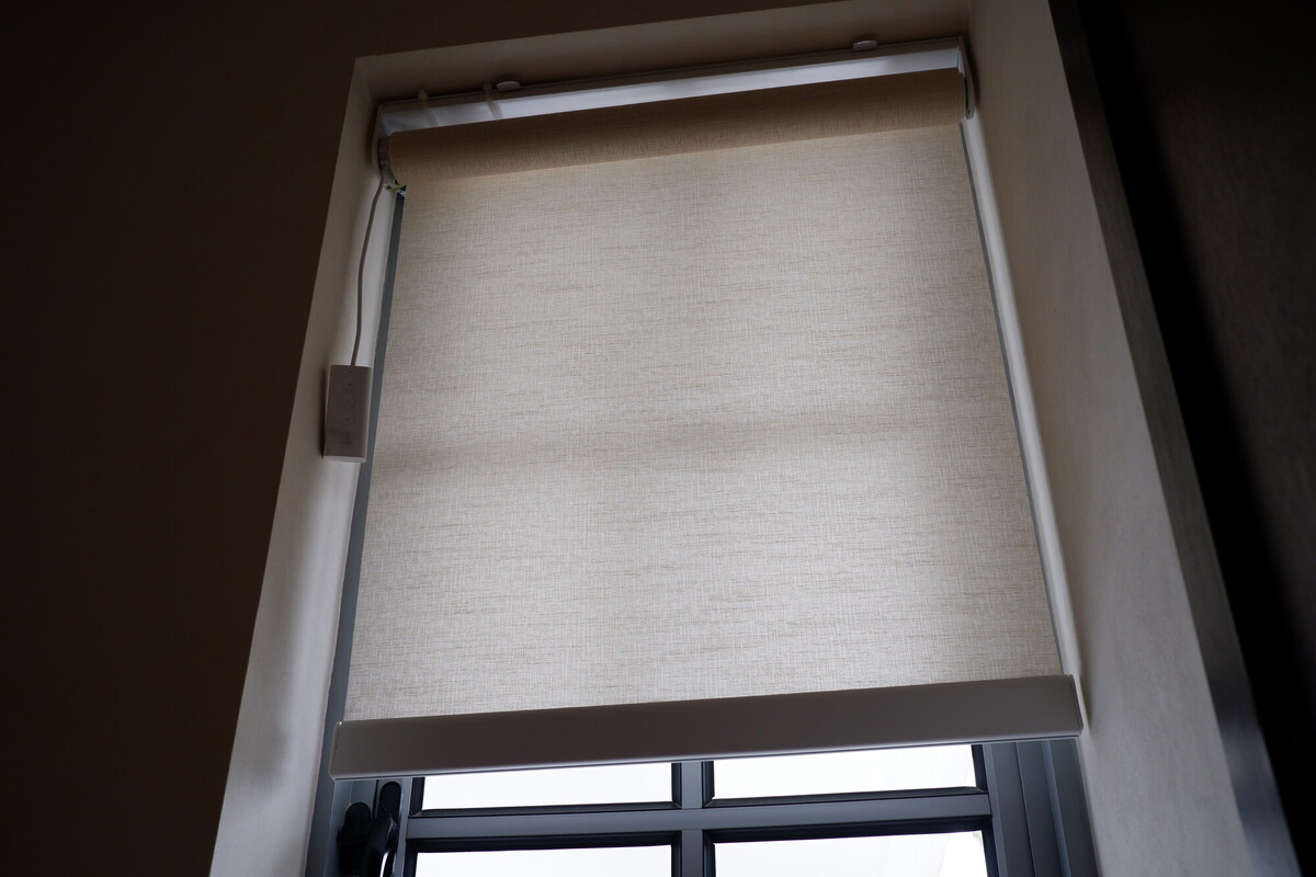 Motorised roller blind installed at a Singapore window