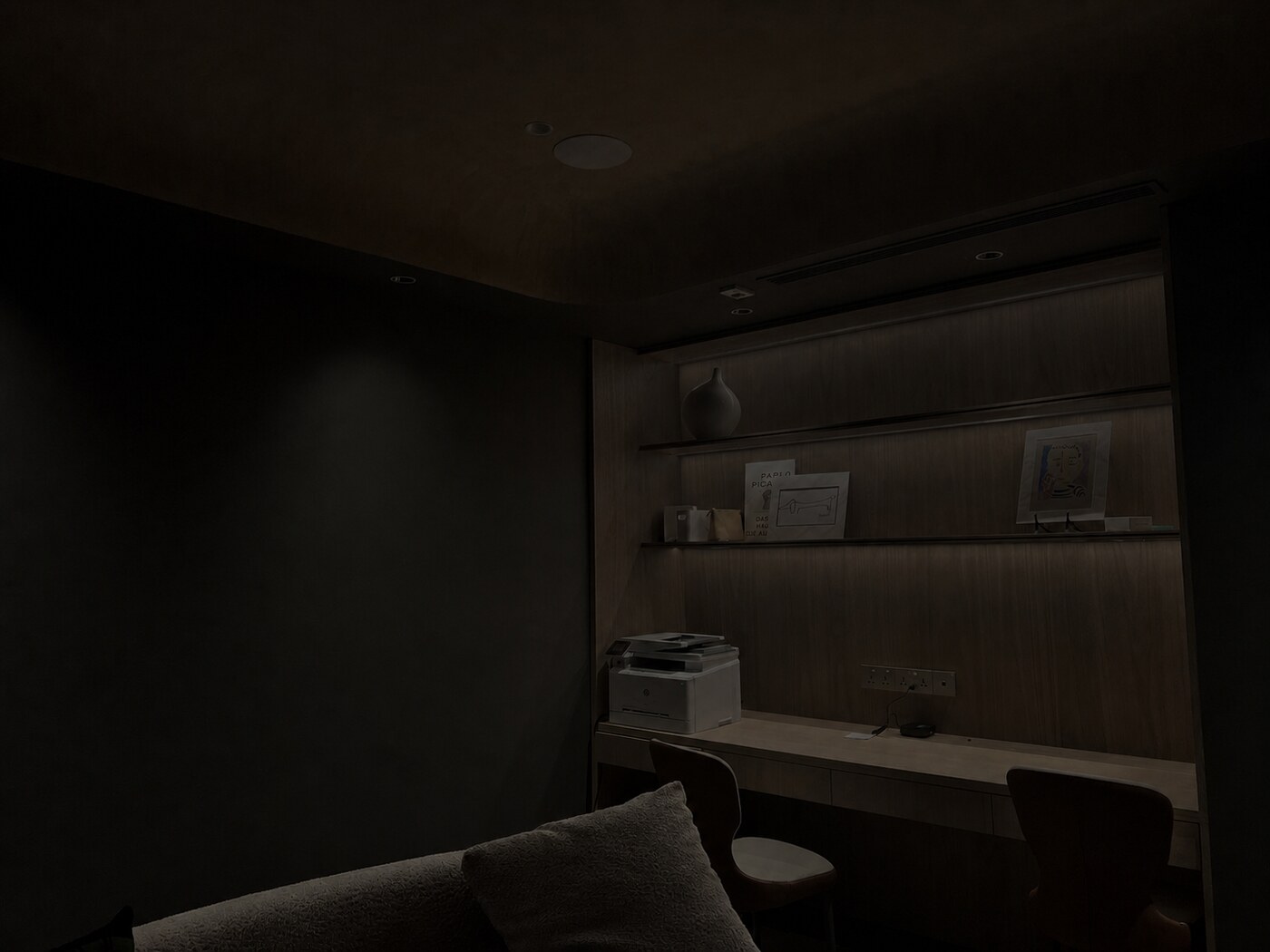 Windowless study with spot, shelf and task lighting at minimum output in a completed HomeSmart project