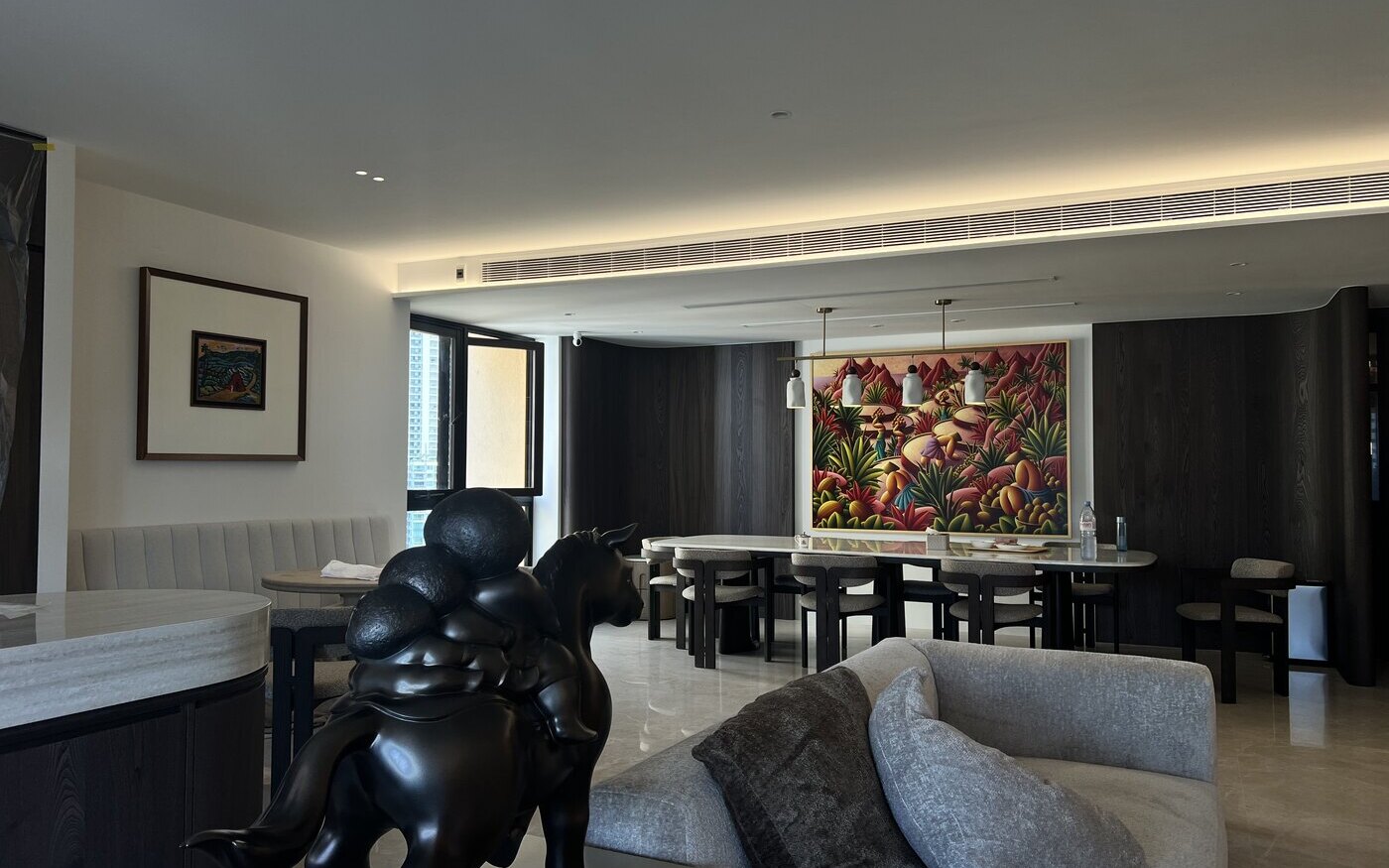 Living and dining room with multiple lighting layers in a completed HomeSmart project