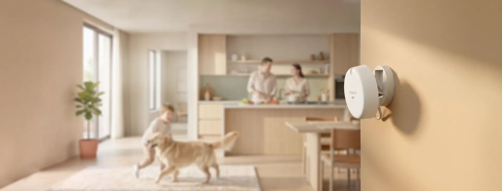 Aqara Spatial Multi-Sensor FP400 on the wall of an open-plan kitchen with a family and dog